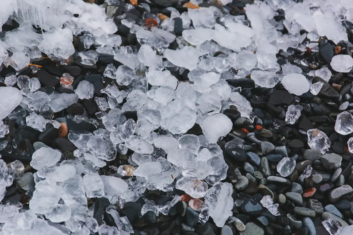 Pellets of ice scattered across the ground after a storm